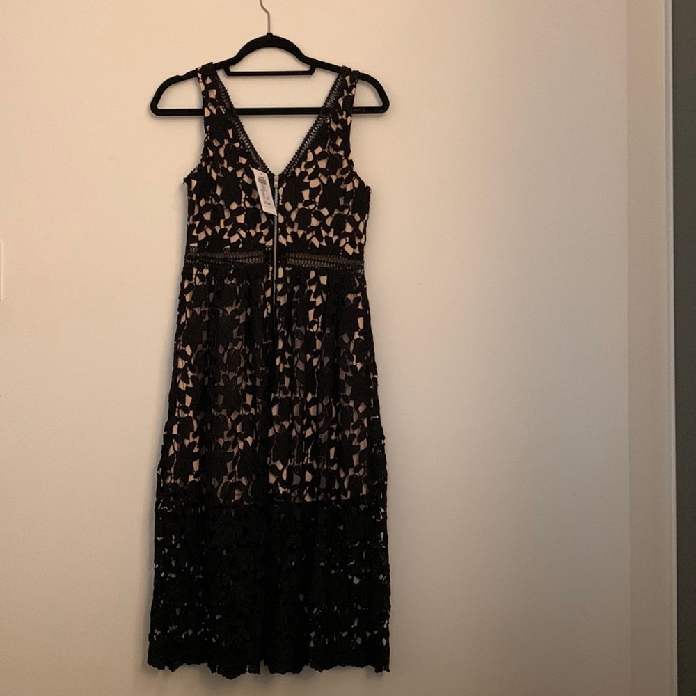 BRAND NEW. Chelsea v neck black lace dress. Tags still on. Retail:$178.
